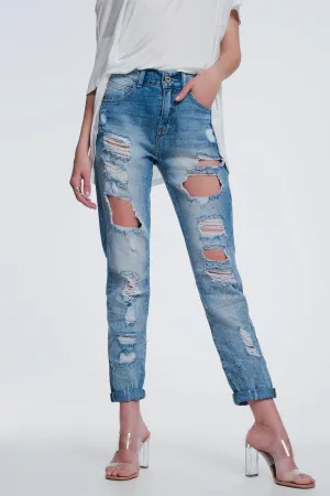 Heavily torn straight jeans in light denim